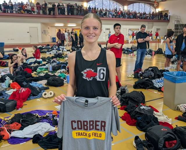 Devils Lake junior Sara Kraft poses after setting a school indoor record in the long jump at the Cobber Indoor. (Photo via Devils Lake Firebirds Track and Field on Facebook)