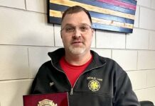 
			
				                                On Tuesday, March 17, Fire Chief Nate Bennett displays the plaque he received at an annual DLFD love feast several days earlier on Saturday, March 14 commemorating his years of service with the Devils Lake Fire Department.
                                 PHOTOS BY MARK C. ROBINSON

			
		