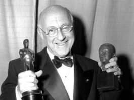 
			
				                                Cecil B. De Mille poses in Los Angeles on March 19, 1953 at the 25th annual Academy Awards. He holds his Oscar for best picture, The Greatest Show on Earth, and the Irving G. Thalberg Memorial Award for consistently high production achievement. The 1953 Academy Awards were the first televised awards ceremony.
                                 AP PHOTO/STF

			
		