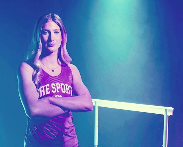 Kelsie Belquist near a foldable hurdle. (Submitted photo)