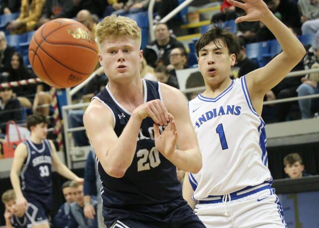 Four Winds/Minnewaukans Keyson Littlewind guards Shiloh Christians Carson Quam during the Division A state quarterfinals at the Fargodome. (Photo by Mojo Hill)