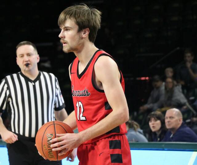 Hunter Hagler looks to pass during North Stars state qualifier game in Fargo. (Photo by Mojo Hill)