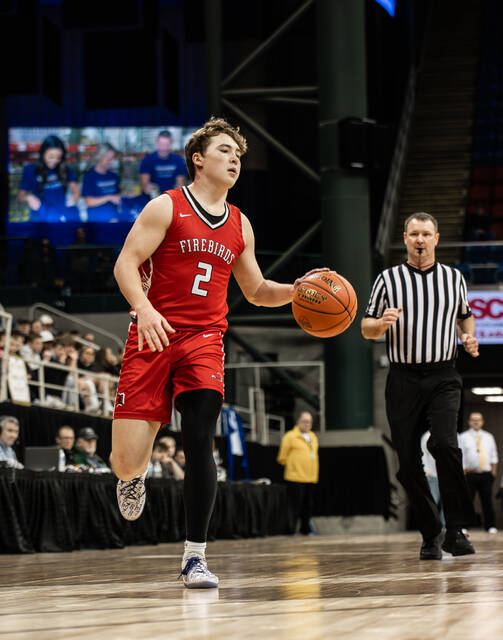 Mason Palmer dribbles down the sideline. (Photo by Cameron Carlson)