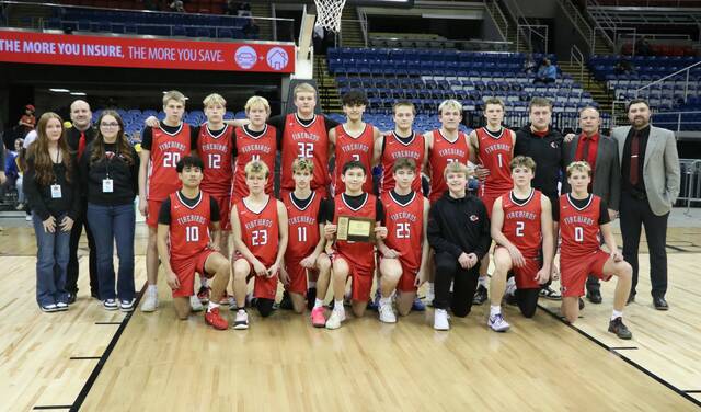The Devils Lake boys basketball team poses for one last team photo after winning the state third-place game at the Fargodome. (Photo by Mojo Hill)