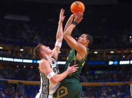 
			
				                                North Dakota State forward Treyson Anderson (44) shoots over Michigan State forward Jaxon Kohler (0) during the second half in the first round of the NCAA college basketball tournament, Thursday, March 19, 2026, in Buffalo, N.Y.
                                 AP Photo/Jeffrey T. Barnes

			
		