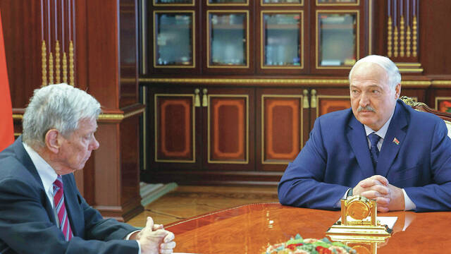 In this photo released by Belarusian presidential press service, Belarusian President Alexander Lukashenko, right, and U.S. Presidential envoy John Coale talk during their meeting in Minsk, Belarus, Thursday, March 19, 2026.
                                 Belarusian Presidential Press Service via AP