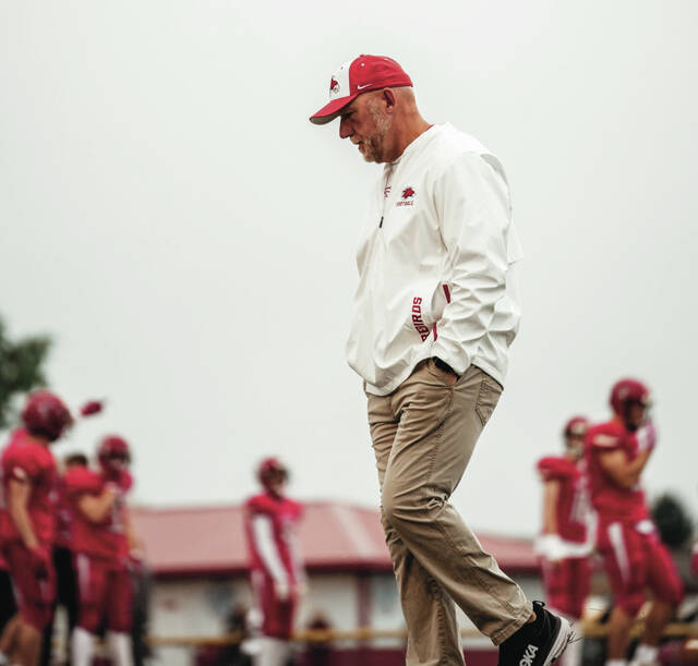 Devils Lake head coach Todd Lambrecht walks quietly down the field in preparation for a game.
                                 Photo by Noah Clooten
