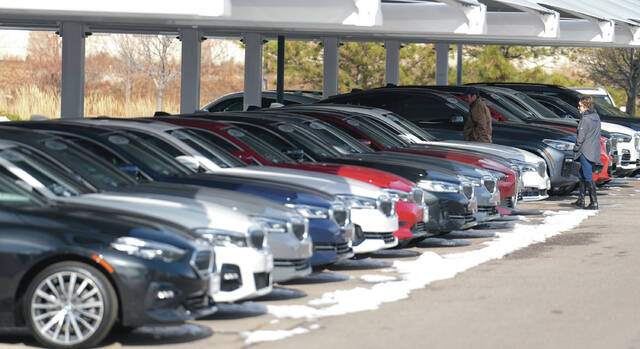 FILE - Unsold 2023 and 2024 models sit on display outside a BMW dealership on Thursday, Nov. 30, 2023, in Loveland, Colo.
                                 AP Photo/David Zalubowski, File