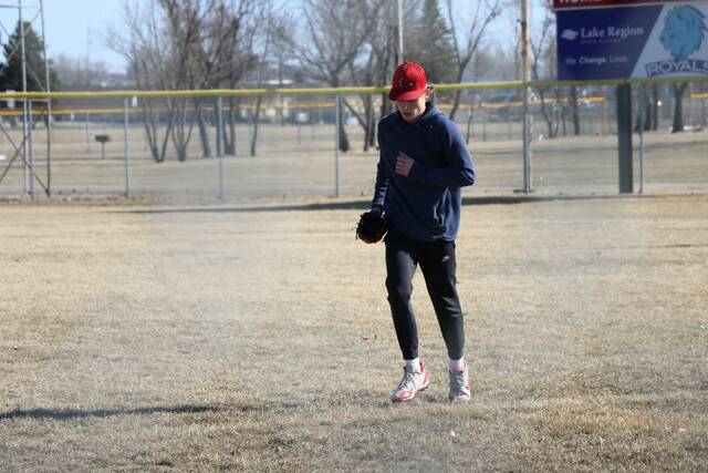 Taydon Triepke runs in from the outfield.
                                 Photo by Mojo Hill