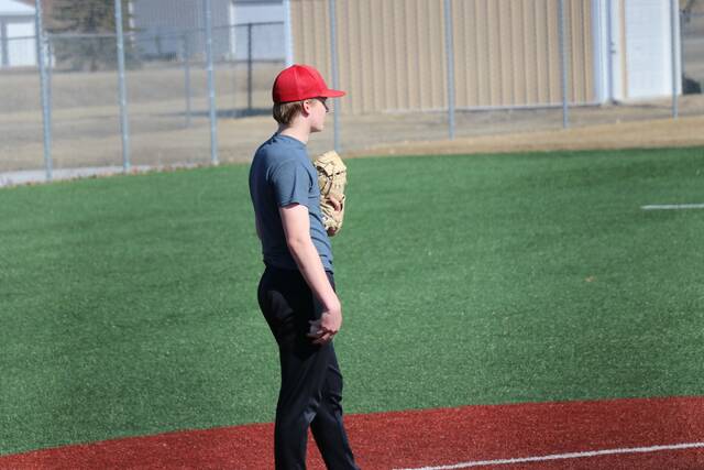 Catcher Riley Brenno-Quale waits in front of home plate.
                                 Photo by Mojo Hill
