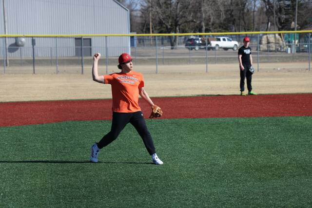 Third baseman Easton Kraft makes the throw after fielding a slow roller.
                                 Photo by Mojo Hill