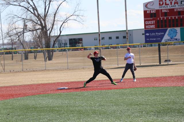 Shortstop Mason Palmer turns a double play.
                                 Photo by Mojo Hill