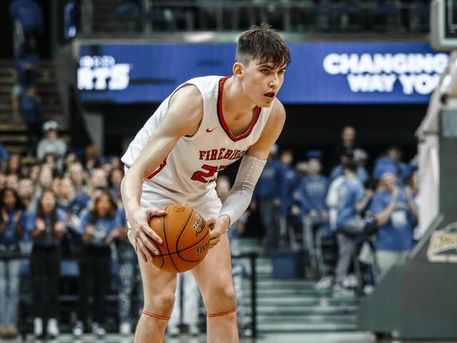 Devils Lakes Wylee Delorme decides his next move while controlling the basketball during the 2024 Division A state championship game against Kindred.
                                 Photo by Noah Clooten