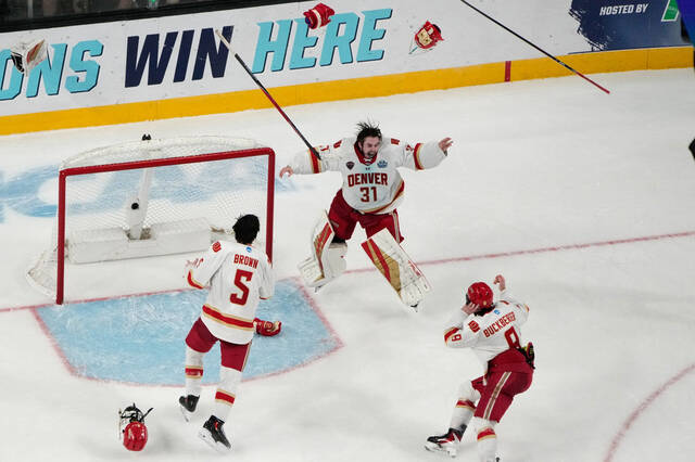 Denver goaltender Johnny Hicks (31) celebrates with teammates after defeating Wisconsin in the championship game at the NCAA Frozen Four mens college hockey tournament Saturday, April 11, 2026, in Las Vegas.
AP Photo/John Locher