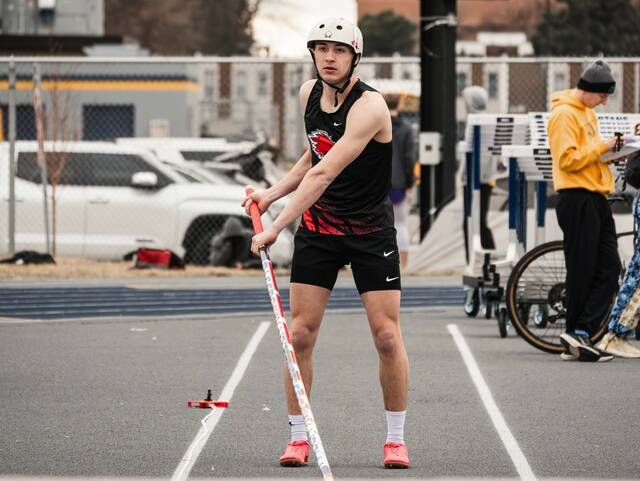 Devils Lakes Tucker Bennett prepares for his pole vault. He took first place in the event.
                                 Photo by Cameron Carlson
