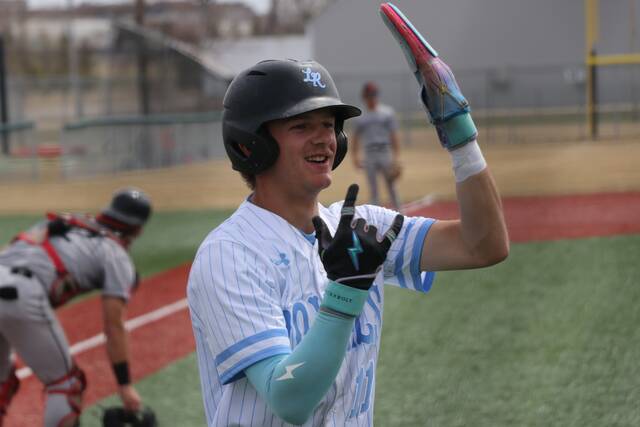 Beau Brodina celebrates after crossing home plate.
                                 Photo by Mojo Hill