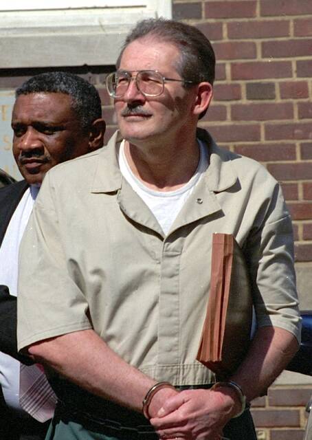 In this April 28, 1994 file photo, former CIA agent Aldrich Ames leaves federal court in Alexandria, Va. Ames, who passed U.S. secrets to the Soviet Union and then Russia, pleaded guilty to espionage and tax evasion, and was sentenced to life in prison without parole.
                                 AP Photo/Denis Paquin, File
