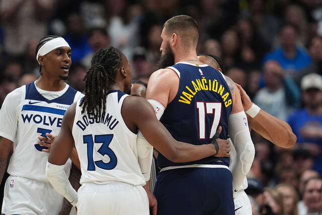 Minnesota Timberwolves forward Jaden McDaniels, left, exchanges words with Denver Nuggets center Jonas Valanciunas, center right, as Minnesota guards Ayo Dosunmu, front left, and Jaylen Clark surround Valanciunas in the second half in Game 5 of a first-round NBA playoffs basketball series Monday, April 27, 2026, in Denver.
AP Photo/David Zalubowski