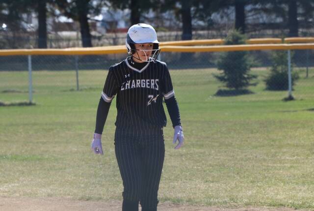 Jenna Sundeen retreats to first base after legging out a single.
                                 Photo by Mojo Hill
