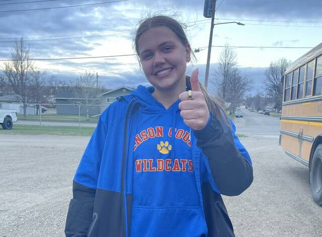 Lacie Fautsch gives a thumbs up after qualifying for state in shot put.
                                 Photo courtesy of Benson County Track & Field