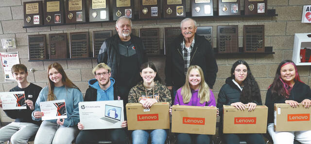 Devils Lake Youth Activities Association awarded students with new computers and scholarships at the After Prom Party held last month at DLHS. Shown here are front row: Mark Bommersbach ($1000 scholarship), Madison Hettwer ($1,000 scholarship), Mason Haugen (laptop), Vera Owlboy (chromebook), Jadeyn Kempel (chromebook), Natalie Romero (chromebook), Naima White (chromebook). Back row: Bob Homan and Ed Brown from the Devils Lake Youth Activities Association.