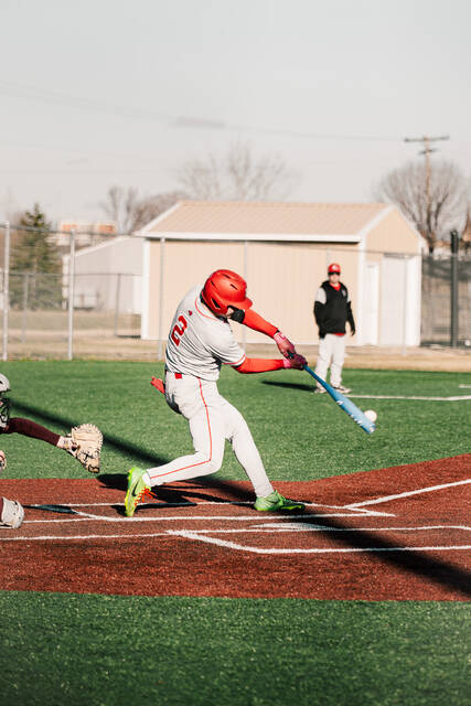 Mason Palmer connects his bat to the ball.