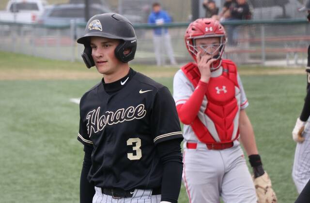 Horaces Cason Borchardt looks towards the away dugout during a game at DLYA Field against Devils Lake.
Photo by Mojo Hill
