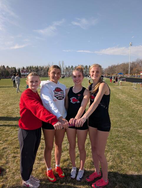 Siri Bryce Volk, Raeleigh Myklebust, Ella Wass and Sara Kraft pose after breaking a Devils Lake school record in the 4x100 relay.
Photo courtesy of Devils Lake Firebirds Track and Field