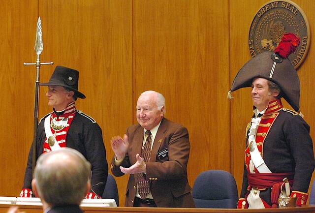 North Dakota Speaker of the House Matt Klein, R-Minot, center, applauds with House members while welcoming explorers Lewis and Clark at the Capitol in Bismarck, N.D., Tuesday, April 5, 2005. The historical impersonators and others are retracing the 200-year old journey of Lewis and Clark accross the continent. Portraying Meriwether Lewis, left, is Bryant Boswell, and portraying William Clark, right, is Peyton C. Clark.
                                 AP File Photo/Will Kincaid