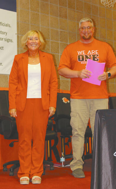After 33 years in Devils Lake Public Schools, Lara Prozinski will be retiring this year. She will, however, continue her work with the DLPS Development Fund. She stated in the Recognition Program booklet, I leave with a full heart, lasting friendships and immense pride in being part of the Devils Lake Public Schools community. Prozinski is shown here with Cory Meyer, Devils Lake School Board President.
                                 Photo by Louise Oleson, DLJ