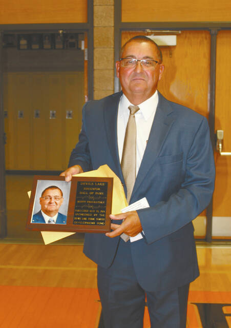 Scott Privratsky was indicted into the DLPS Educator Hall of Fame at Wednesdays recognition program. He thanked his former mentors and friends from the Devils Lake school system but first thanked his wife and family for their love and support through the years. Privratskys career began in Binford, N.D., in 1983. By 1988 he was hired to teach and coach for Devils Lake schools, was Activities Director for two years, business manager for 14 years and ended his career in 2020 when he retired after eight years as Superintendent.
                                 Photo by Louise Oleson, DLJ