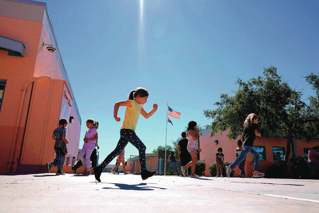 Whittier Elementary School students enjoy recess, Tuesday, Oct. 18, 2022 in Mesa, Ariz.
                                 AP Photo/Matt York,File