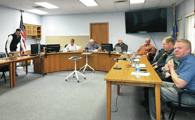 Commissioners and other board members prepare for the Devils Lake City Commission meeting held on May 18.
                                 Photo by Mark C. Robinson