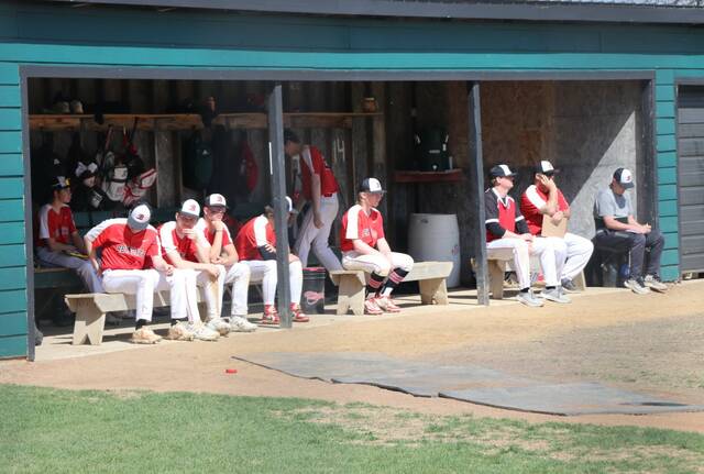 North Star baseball players look on from the dugout during the Region 5 baseball tournament in Bottineau.
Photo by Mojo Hill