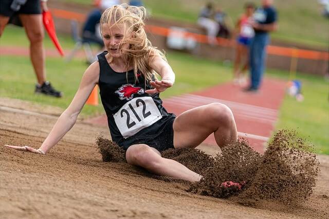Sara Kraft lands in the sand during her state championship-winning long jump at the MDU Resources Community Bowl in Bismarck, N.D., on May 21.
Photo by Cody Eisenbeis