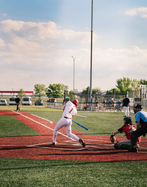 Will Heilman swings at a low pitch during the Devils Lake Storms home opener on Thursday, June 4 at DLYA Field.