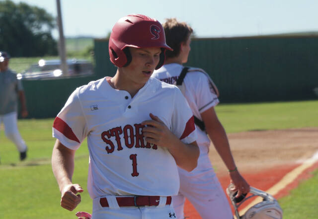 Will Heilman crosses home plate.