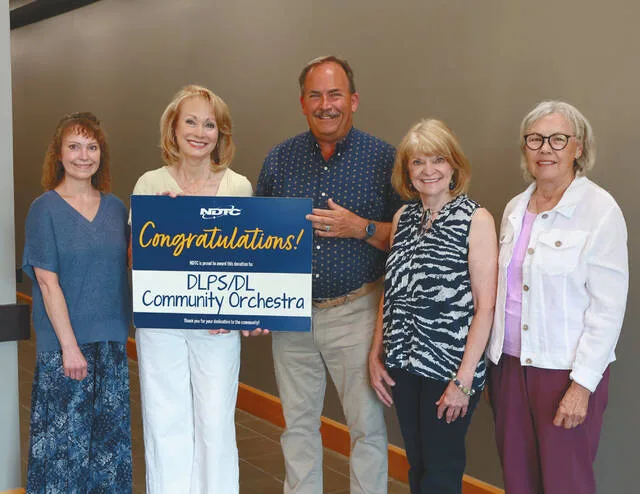 NDTC awards donation to DLPS, DL Community Orchestra