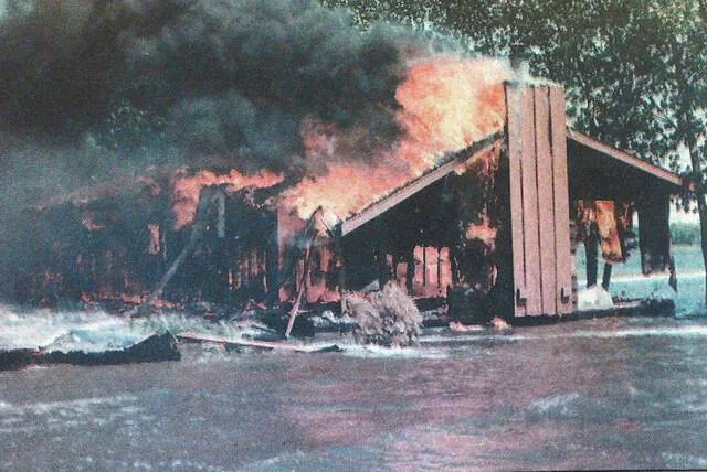 The second photo was of Kevin Spauldings garage burning as Devils Lake water laps at the driveway.