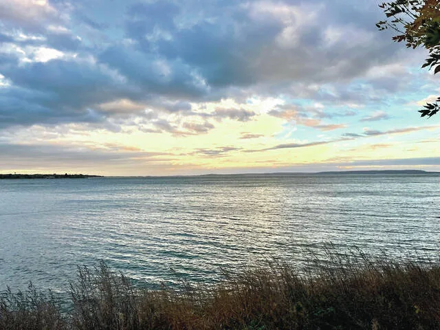 The enchanted waters of Devils Lake on the late afternoon of Sunday, Oct. 12, 2025.
                                 Photo by Mark C. Robinson, DLJ