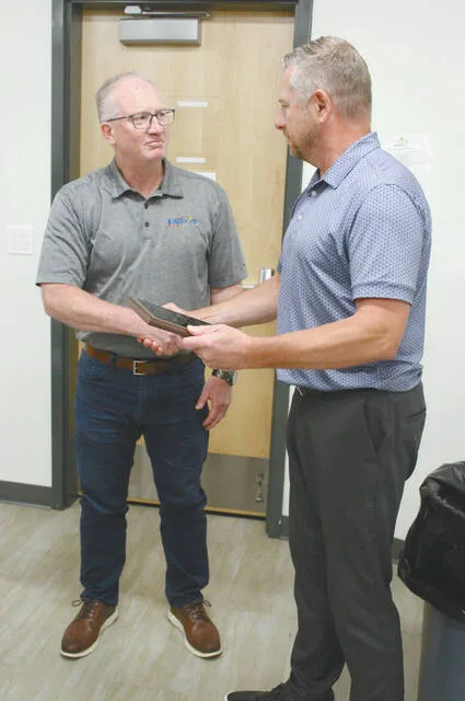 After the meeting was adjourned Devils Lake Park Board Superintendent Steven Geigle (R) thanked Board President Jamie Beck (L) for his years of service to the community as he retires after more than 17 years on the board.
