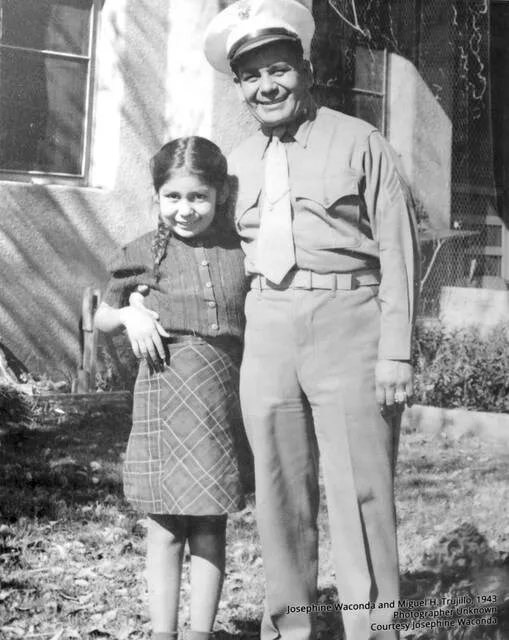 This March 9, 2012, file photo shows a photograph of Miguel Trujillo of Isleta Pueblo, N.M., and his daughter on display for an exhibit at the Indian Pueblo Cultural Center in Albuquerque, N.M. Trujillo fought in 1948 for the right of American Indians to vote in New Mexico. Trujillo fought in 1948 for the right of American Indians to vote in New Mexico and came decades after the 14th Amendment of the U.S. Constitution grants all people born in the U.S. citizenship.
                                 AP Photo/Susan Montoya Bryan, File
