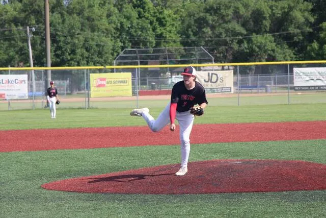 Talan Gregory follows through on his windup after delivering a pitch during Devils Lakes game against Rugby on Wednesday, July 8 at DLYA Field.
                                 Photo by Isaac Vaagen