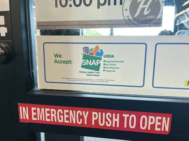 A sign advertises that SNAP benefits are accepted at a Hornbachers in north Fargo, North Dakota, on July 7, 2026.
                                 Photo by Ceilidh Kern/For the North Dakota Monitor