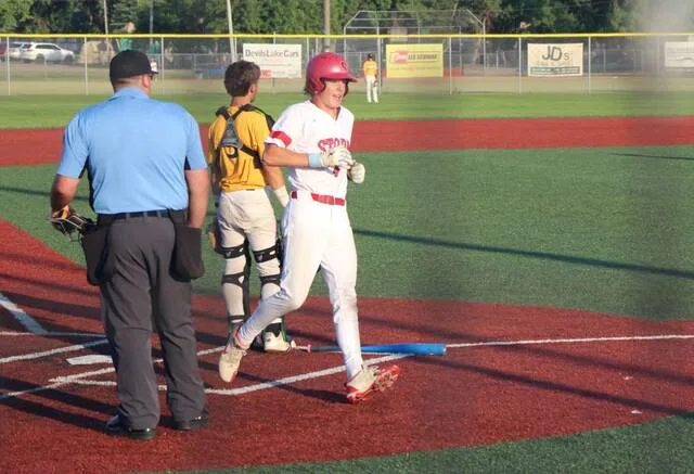 Taydon Triepke hustles past home plate during Devils Lakes doubleheader against Park River Post 147 at DLYA Field on Friday, July 17.
                                 Photo by Isaac Vaagen