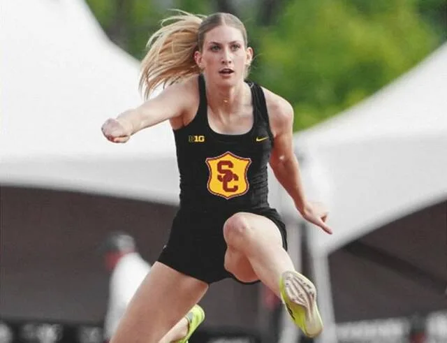 Kelsie Belquist leaps during a hurdles event for Nebraska, edited here into a USC uniform.
                                 Photo courtesy of USC track and field