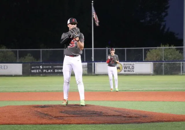 Mason Palmer gets set before going into his windup during the Class A East semifinals at Starion Bank Field.
                                 Photo by Mojo Hill