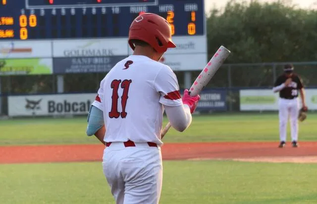 Devils Lake center fielder Fausten Olson prepares to step in the batters box during the Class A East championship at Starion Bank Field.
                                 Photo by Mojo Hill