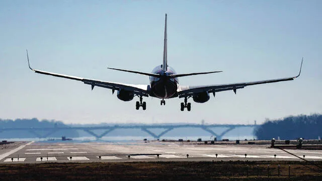 A plane lands at Ronald Reagan Washington National Airport in Arlington, Va., Dec. 30, 2022.
                                 AP Photo/Carolyn Kaster, File