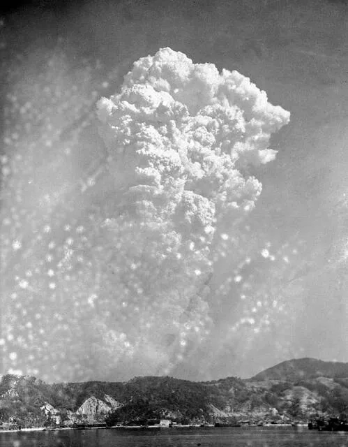 Smoke rises around 20,000 feet above Hiroshima, Japan, after the first atomic bomb was dropped, Aug. 6, 1945.
                                 AP Photo, File